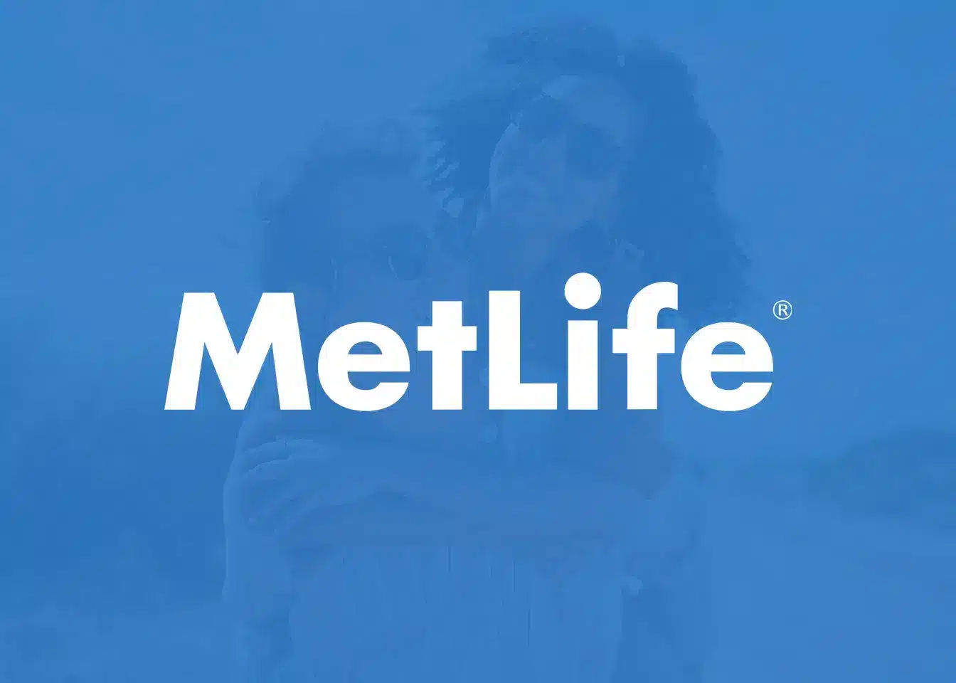 MetLife logo displayed on blue background with faded building silhouette behind text